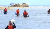 USCG personnel and grounded vessel
