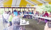 Port Administration director, Christopher King (at podium front) speaking to the gathering,