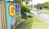 In this May 15, 2017, file photo, tourists walk through a shopping district in Tamuning, Guam. Security and defense officials on Guam said on Aug. 9, 2017, that there is no imminent threat to people there or in the Northern Mariana Islands after North Korea said it was examining its operational plans for attack. (AP Photo/Haven Daley, File) In this May 15, 2017, file photo, tourists walk through a shopping district in Tamuning, Guam. Security and defense officials on Guam said on Aug. 9, 2017, that there is no imminent threat to people there or in the Northern Mariana Islands after North Korea said it was examining its operational plans for attack. (AP Photo/Haven Daley, File)