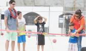 Krista Corry cuts the ribbon to officially open Pacific Horizon School's new half court. Also pictured are Jason Corry and three of their sons, Brady, Skyler and Riley.  [Courtesy photo]