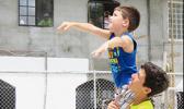 Micah Corry bolsters his younger brother, Riley, to make a first shot.  [Courtesy photo]