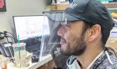 Dr. Eric Muraoka wearing one of his face shields he printed on his 3-D printer