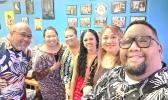Haylie-Jeanette Tuiaoopo, center with office staff