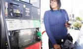 According to the report, the Transportation index is majorly affected by changes in unleaded gas and diesel prices. woman pumping gasoline into her car