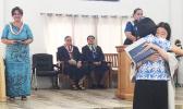 Manumalo Academy’s Class of 2017 valedictorian Alice Park hugging her mom after receiving her diploma last Friday morning, while DOE Director Dr. Ruth Matagi-Tofiga, Pastor Filifaatali Mike Fuiava, and Paster Lemmy Seumanu look on. [photo: BC]