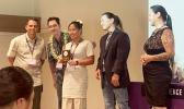Amelie Chen and her parents at winners' ceremony