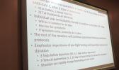 A large screen displayed information on the local resident who tested positive for COVID-19