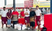 Tafuna High School’s Interact Club members with donations