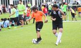 A Black Roses’ player dribbles against a Tafuna Jets’ opponen