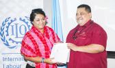 WELL DONE: Joyetter Luamanu recieves an award from the Ministry of Commerce, Industry and Labor Chief Executive Officer Pulotu Lyndon Chu Ling for her work in covering Child Labor. (Photo: Misiona Simo)