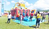 Kids enjoying jumpers at Farm Fair