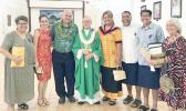 Karl Prendergast (third left) and Bishop Peter Brown (4th left) and other Holy Family parishioners