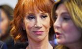 In this June 2, 2017, file photo, comedian Kathy Griffin, left, listens as her attorney Lisa Bloom speaks during a news conference in Los Angeles, to discuss the backlash since Griffin released a photo and video of her displaying a likeness of President Donald Trump's severed head. The AP reported on July 28, 2017, that a story claiming Griffin was jailed last month for walking around New York wearing fake blood and a Trump Halloween mask is a hoax. (AP Photo/Mark J. Terrill, File) In this June 2, 2017, file photo, comedian Kathy Griffin, left, listens as her attorney Lisa Bloom speaks during a news conference in Los Angeles, to discuss the backlash since Griffin released a photo and video of her displaying a likeness of President Donald Trump's severed head. The AP reported on July 28, 2017, that a story claiming Griffin was jailed last month for walking around New York wearing fake blood and a Trump Halloween mask is a hoax. (AP Photo/Mark J. Terrill, File)