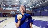 Heritage High School Timberwolves, junior Katie Peneueta with her gold medal.