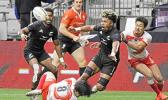 New Zealand's Kitiona Vai offloads the ball