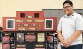 Koneferinisi Purcell of Manumalo Academy with his project "The Orphan Train Movement: A Ride to a Better Future?"