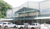 Laufou Shopping Center entrance and parking lot.