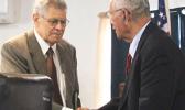 Fonoti Douglas Jessop (left) shakes hands with Sen. Soliai Tuipine Fuimaono