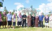 Gov. Lolo Matalasi Moliga (7th from left), along with G.H.C. Reid & Company Ltd. board chair, Olivia Reid, First Lady Cynthia Malala Moliga and others pose for a group photo