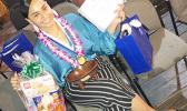 2019 Samoan High School graduate, Lessei Perelini, who also served at the time as president of the student body association, posed in this undated photo distributed by South Pacific Islander Organization (SPIO). Lessei Perelini with her awards