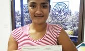 Fuaao Letoi's daughter is pictured receiving Fuaao's 2nd stipend