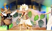 Ace Fuimaono and other actors in scene from Lion King