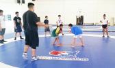 Two of the youngest participants who showed up yesterday for the free wrestling clinics being held at the DYWA Pago Pago Youth Center and taught by visiting coach Alex Ramirez. [photo: Blue Chen-Fruean]