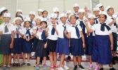 Manumalo Academy students dressesd up in sailor suits