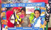 Three of the more than 300 kids and adults who took the virtual reality diving tour this past Saturday