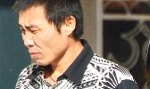 Tao Liu departing the court house after sentencing.  [photo: AF]
