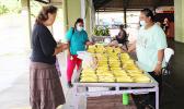 Farmer selling her produce at Fagatogo Marketplace