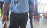 Police officers with the gun outside Samoa court