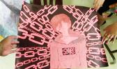 While there is no explanation or description with this artwork — interpretation of one viewer saw the hot pink color of a child’s danger, chain… chain… chain of fools … binding ourselves from without and within