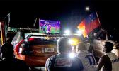 Car club, Leai Sou Feau members watch game in front of the Government building. (Photo: Misiona Simo) Car club, Leai Sou Feau members watch game on a big screen TV in front of the Government building.