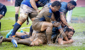 Muddy conditions on the field during Samoa vs Tonga rugby match