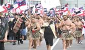 Indigenous Māori people walk through the streets of Wellington,