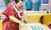 Ms. Marcella Fitisone CUTTING CAKE