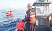 Marine Patrol boat approaching stranding fishing boat.