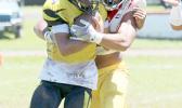 Tafuna Warriors Francisco Mauigoa and a Nuuuli Wildcat ball carrier