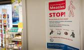 Poster warns against the spread of measles.