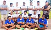 The men's rugby team poses for a group photo. 