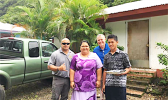 Mrs. Asoiva Togafau (center), with John and Ricky Leulu (far right)