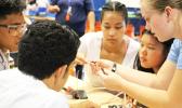 Pictured are some students from Samoana HS getting advice from a visiting Michigan student on starting their own underwater robotics teams.