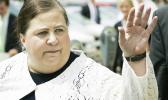In this July 11, 2007 file photo, former Alabama Secretary of State Nancy Worley waves goodbye to a friend after leaving the Montgomery County Courthouse for her trial on charges of violating election laws in Montgomery, Ala. On Thursday, June 14, 2018, The Associated Press has found that stories circulating on the internet that Worley, the head of the Alabama Democratic Party, has recently been arrested are untrue. (AP Photo/Rob Carr, File)