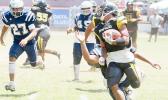 Joe Savaii of the Nu’uuli Wildcats turning on his boosters and beating another Samoana Shark defender to the punch line