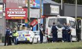 Police stand outside a mosque in Linwood, Christchurch, New Zealand, Friday, March 15, 2019. Multiple people were killed during shootings at two mosques full of people attending Friday prayers. (AP Photo/Mark Baker) Police stand outside a mosque in Linwood, Christchurch NZ