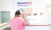 Applicant posting application form at the Samoa Post