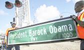 In this Thursday, Dec. 17, 2015 file photo, Dale Moncur, left, and Cedric Anderson of Palm Beach County Traffic Operations, hold a sign for the new President Barack Obama Highway in preparation to change it from the “Old Dixie Highway” in Riviera Beach, Fla. On Friday, Jan. 5, 2018, The Associated Press reported that stories circulating on the internet about President Donald Trump ordering the name of the highway changed back to “Old Dixie” are untrue. (Lannis Waters/Palm Beach Post via AP) In this Thursday, Dec. 17, 2015 file photo, Dale Moncur, left, and Cedric Anderson of Palm Beach County Traffic Operations, hold a sign for the new President Barack Obama Highway in preparation to change it from the “Old Dixie Highway” in Riviera Beach, Fla. On Friday, Jan. 5, 2018, The Associated Press reported that stories circulating on the internet about President Donald Trump ordering the name of the highway changed back to “Old Dixie” are untrue. (Lannis Waters/Palm Beach Post via AP)