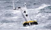Photo of Ocean Cleaning Machine on the water.