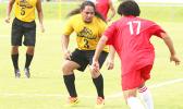 Pago Youth’s striker, Rambo Tapui defending against a Veitongo FC player that was threatening to shoot from a distance during the second half of their match up last Saturday evening – Pago Youth and Veitongo FC were tied, 1 - 1. [photo: TG]